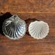 Vintage silver-plated shell butter dish with transparent bowl.