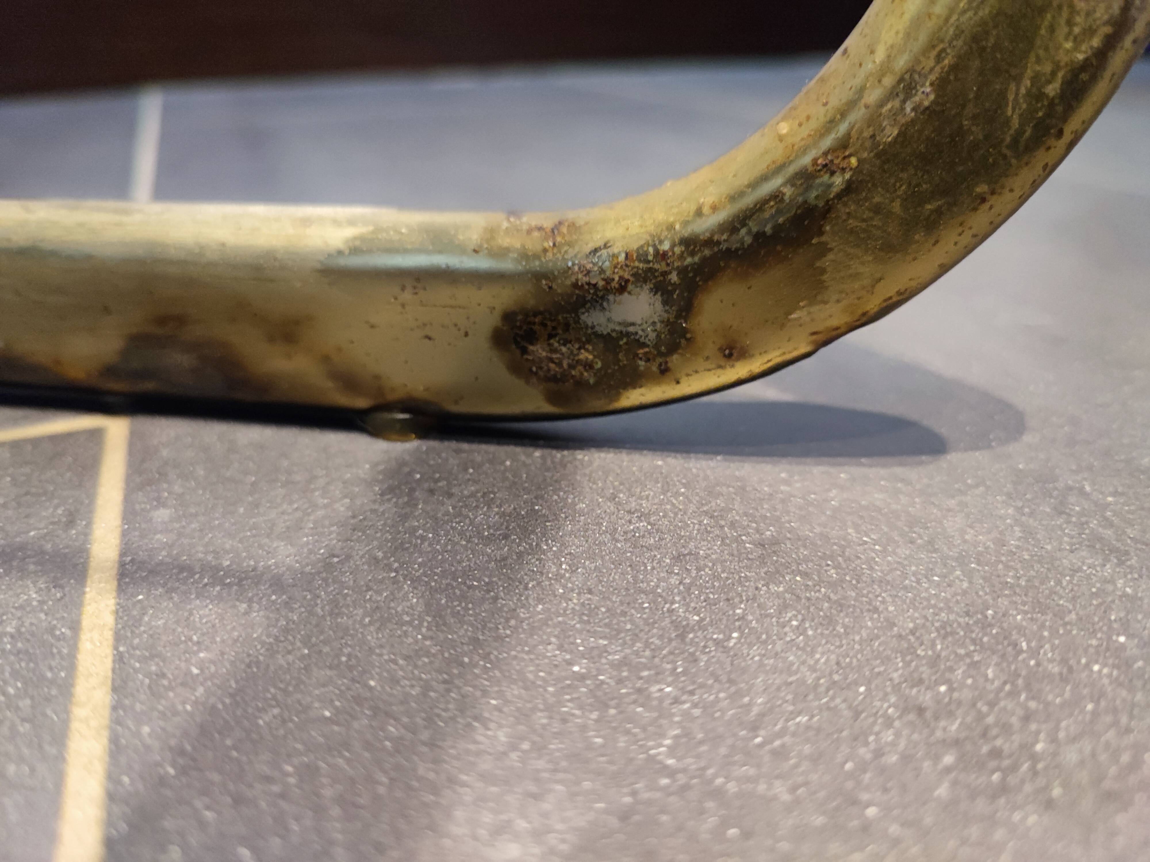 Tubular metal chair covered with gilding