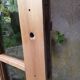 Old wooden door glazed with small tiles