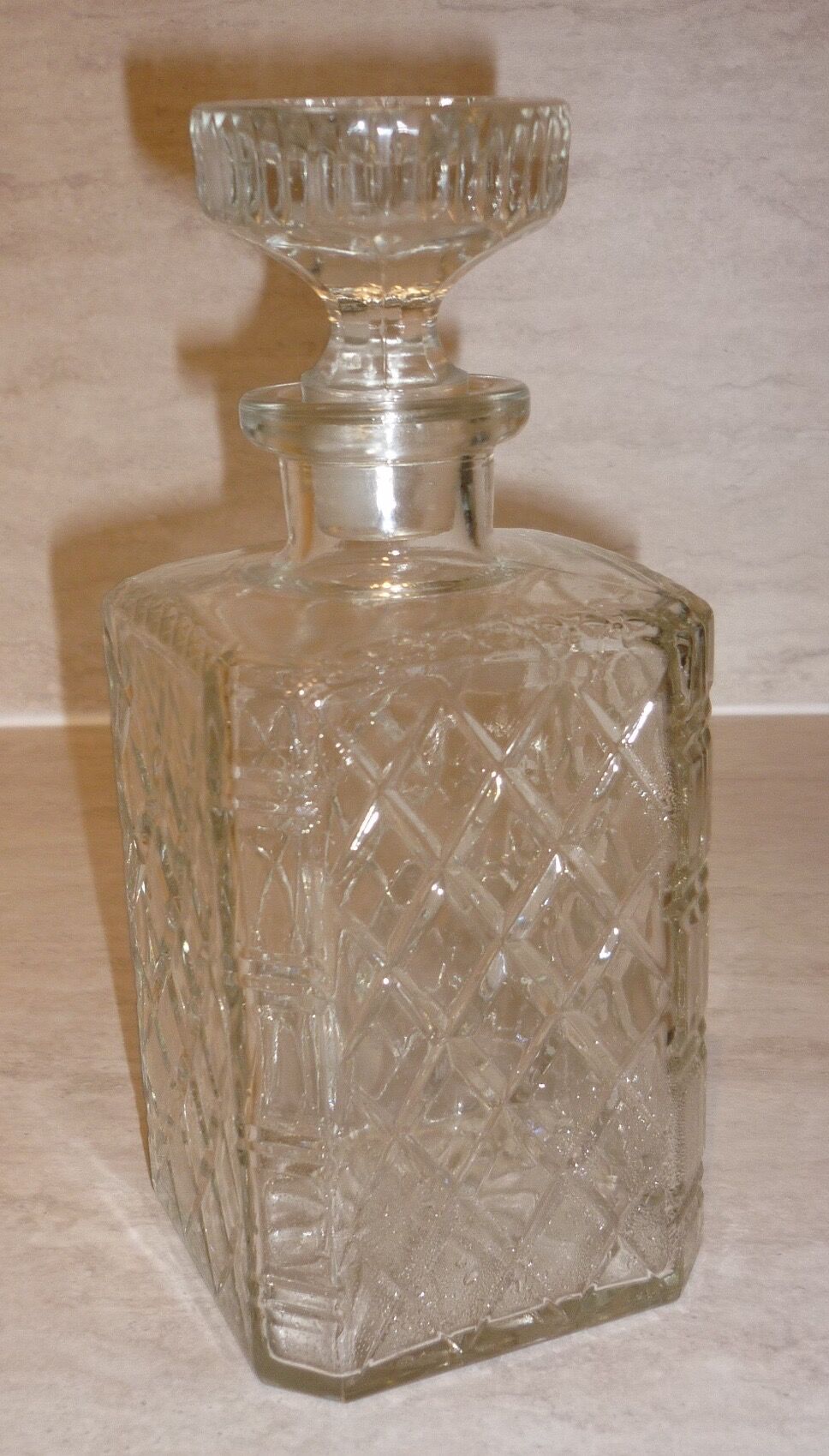 Antique whisky decanter made of chiseled glass