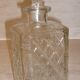 Antique whisky decanter made of chiseled glass