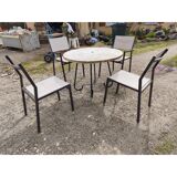 Garden furniture in stone with a vintage 1970s iron base.