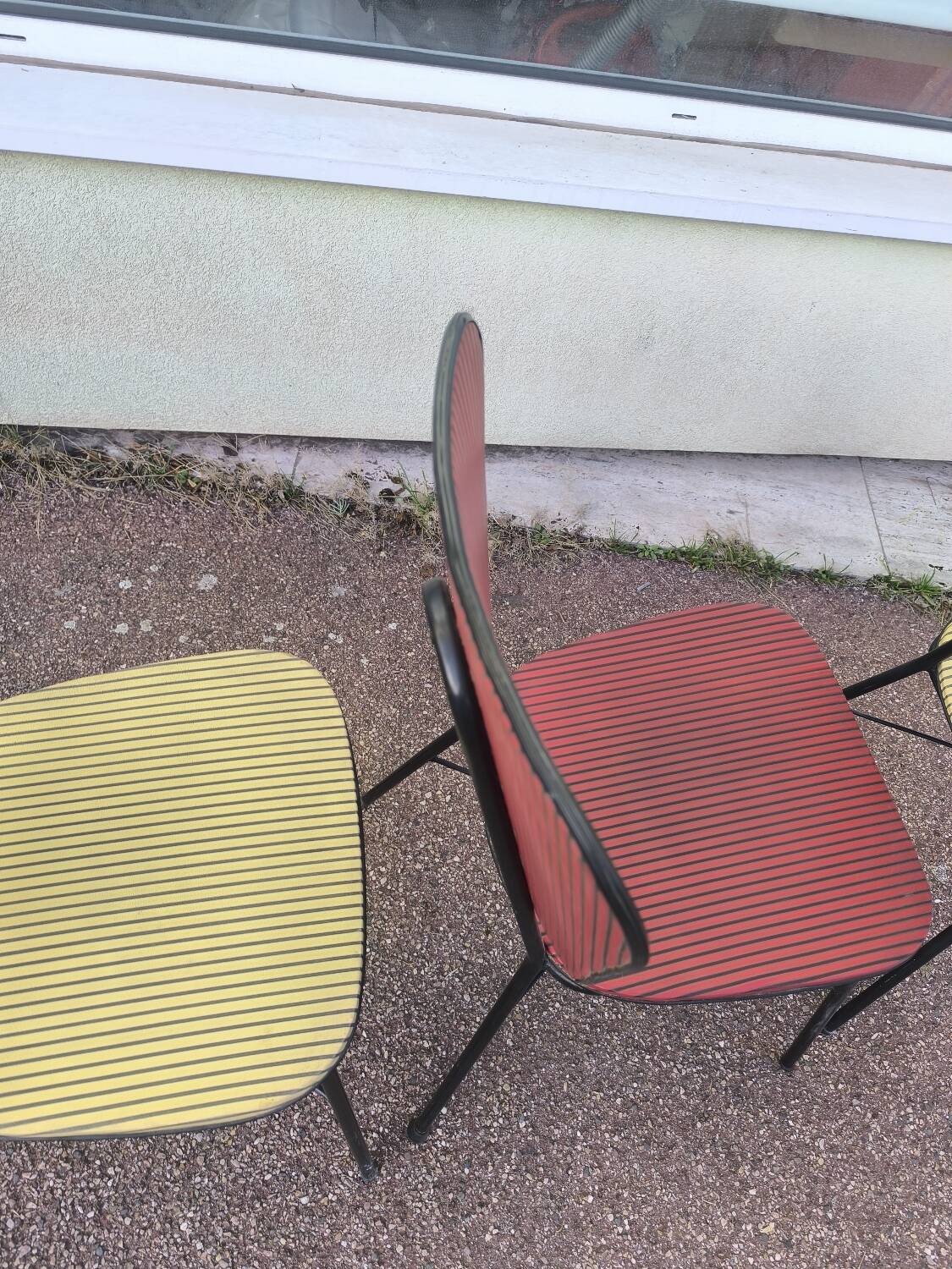 Set of 3 vintage yellow and red faux leather chairs.