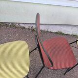 Set of 3 vintage yellow and red faux leather chairs.