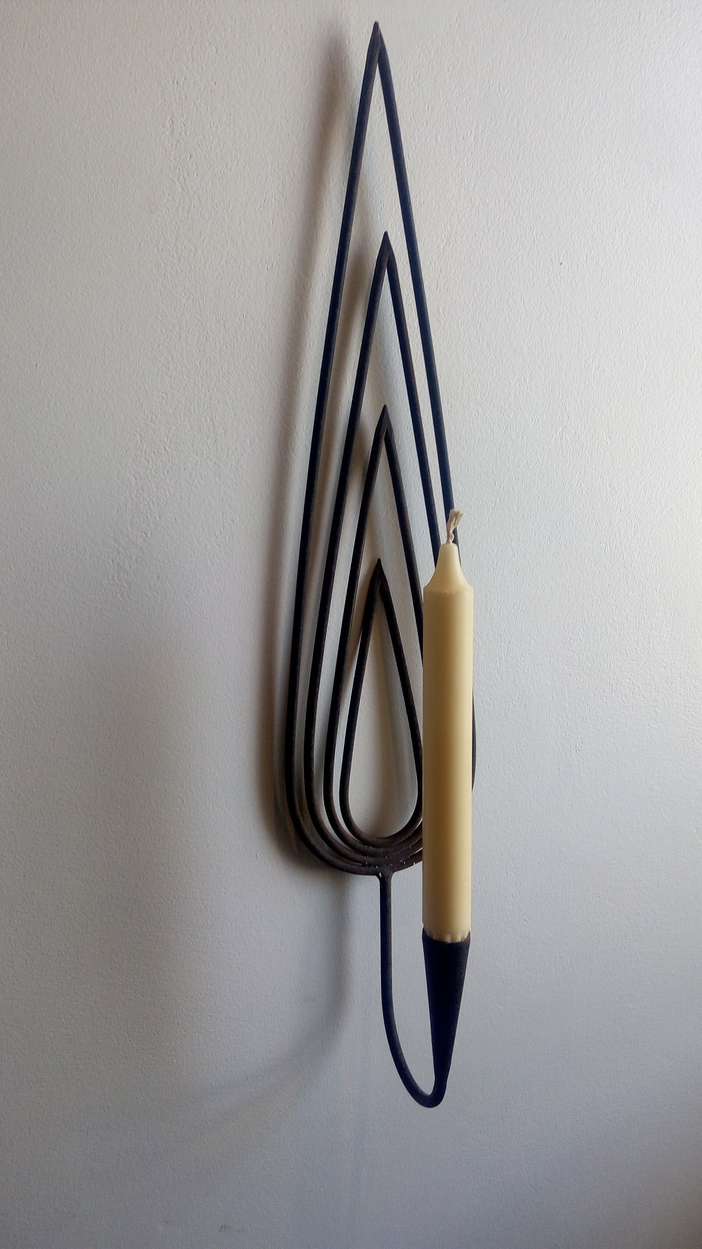 Wrought iron candlestick applied