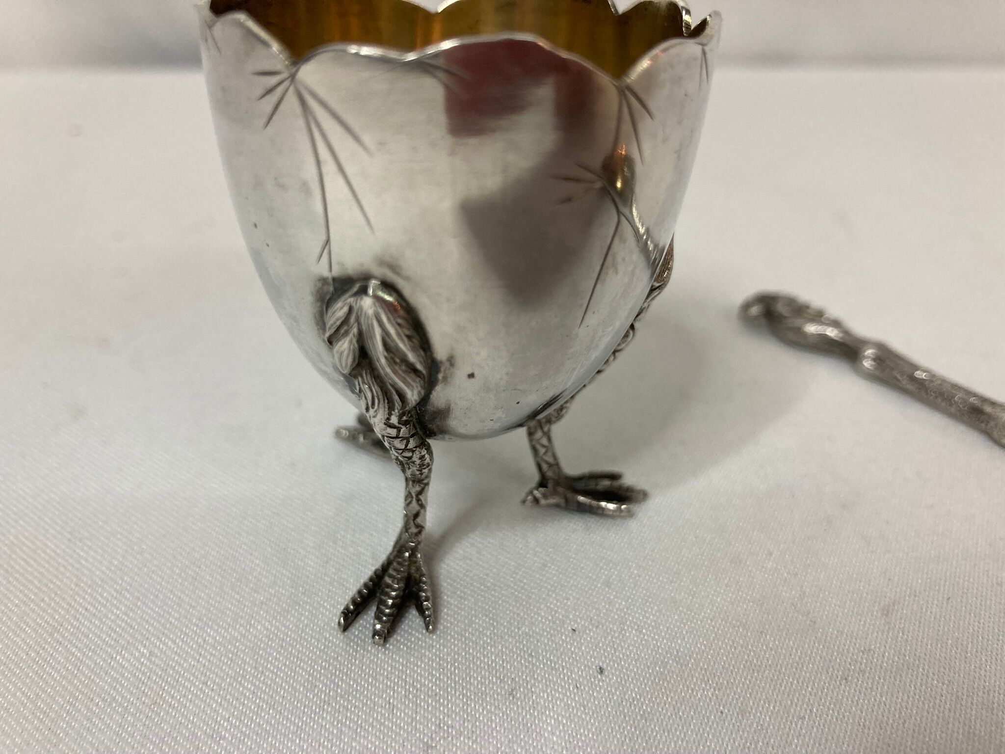 Eggcup feet and silver spoon punches early twentieth century
