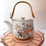 Vintage teapot in stoneware handle in rattan