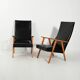 Paire de fauteuils scandinaves à dossier haut en simili cuir des années 1950-60.