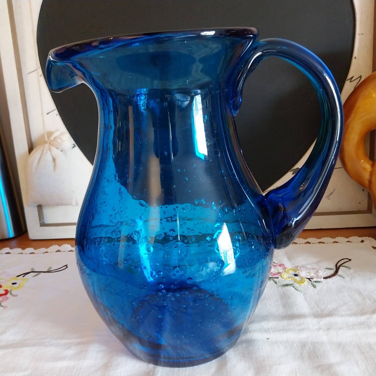 Blue carafe in bubbled blown glass similar to Biot glassware