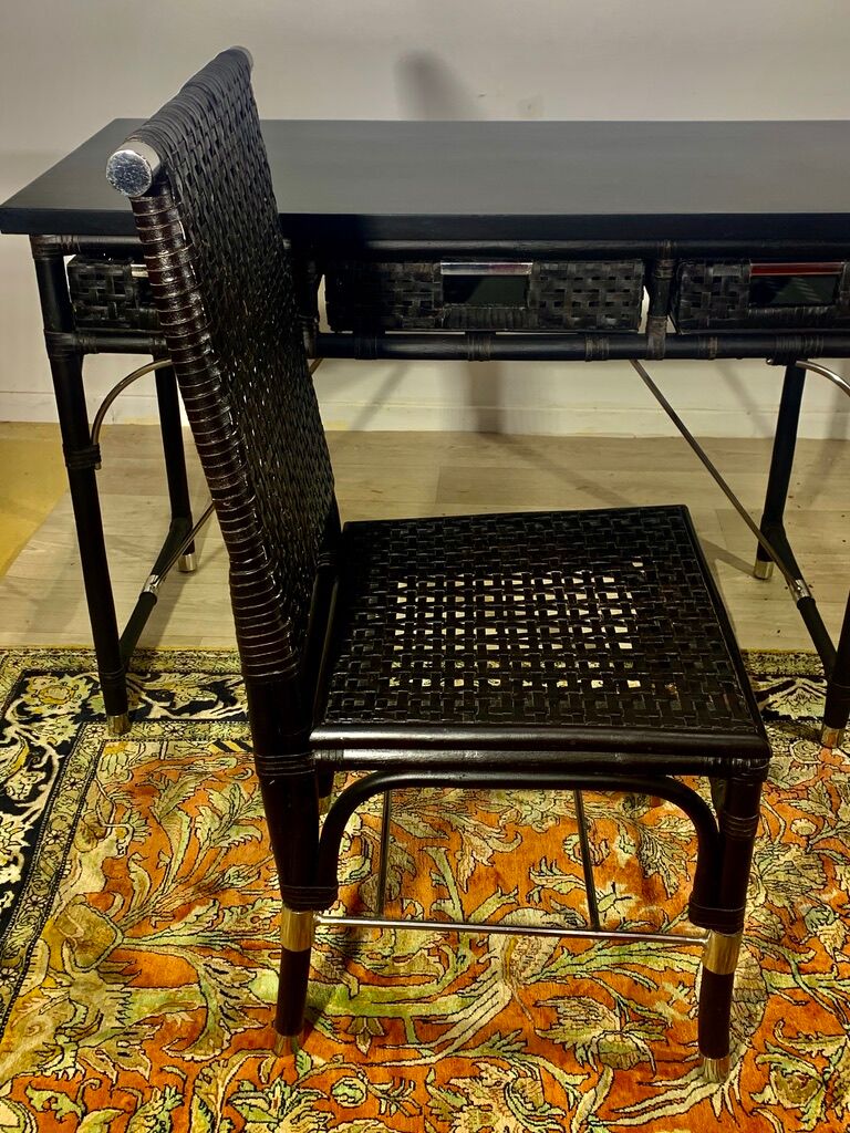 Office with its rattan armchair and brown leather braiding, italian design