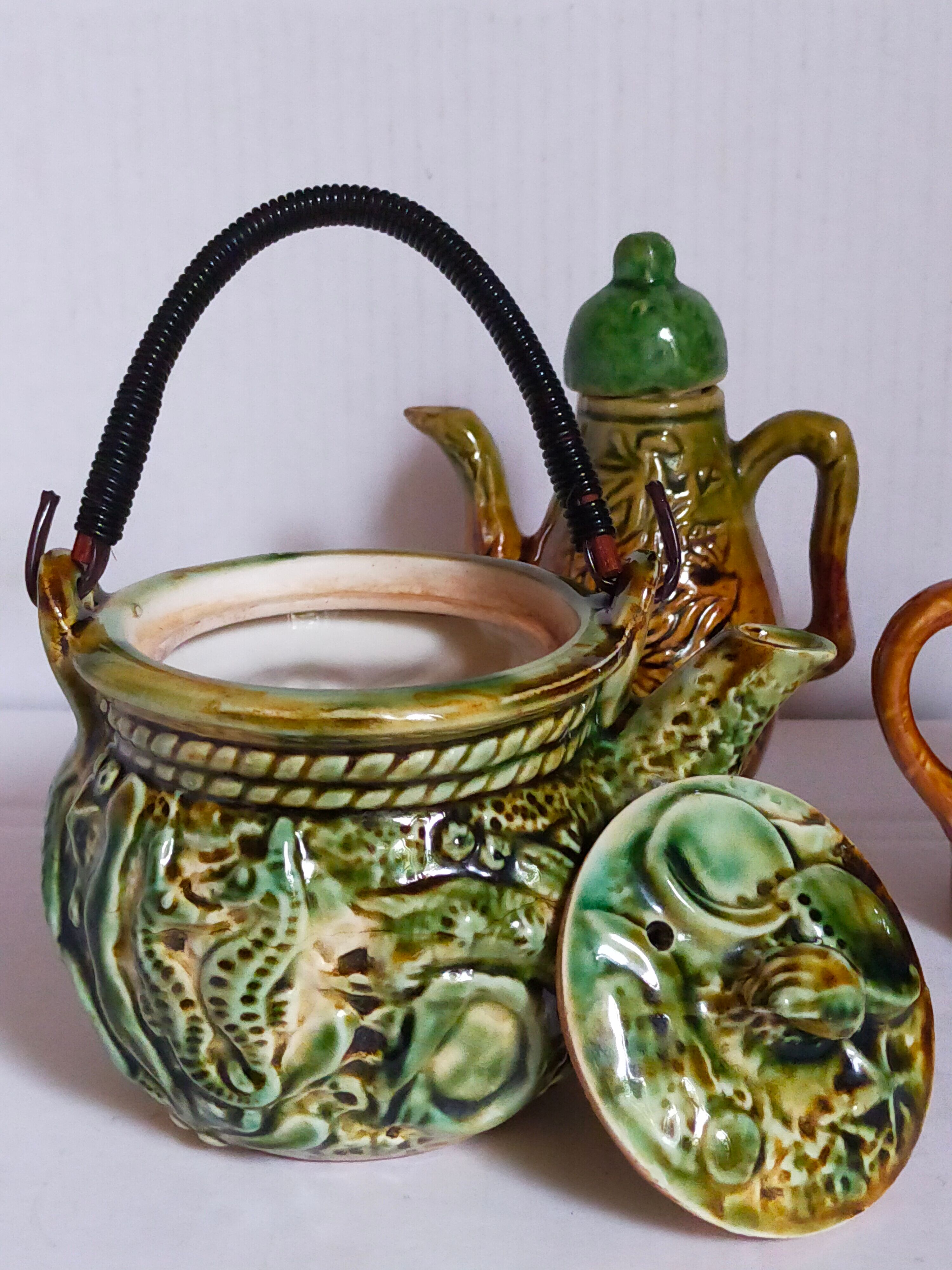 Set of old teapots and honey pot