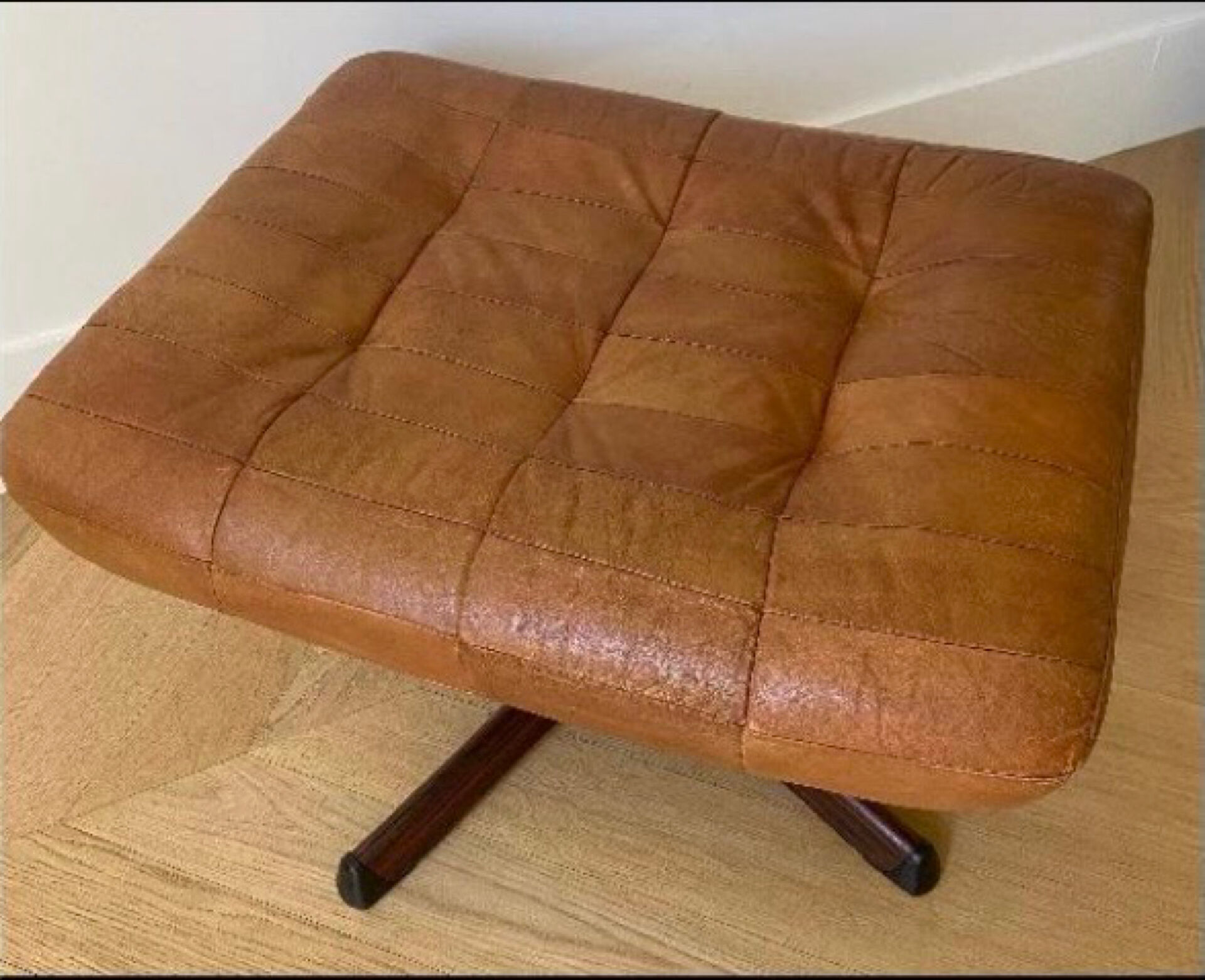 Armchair and footrest in leather