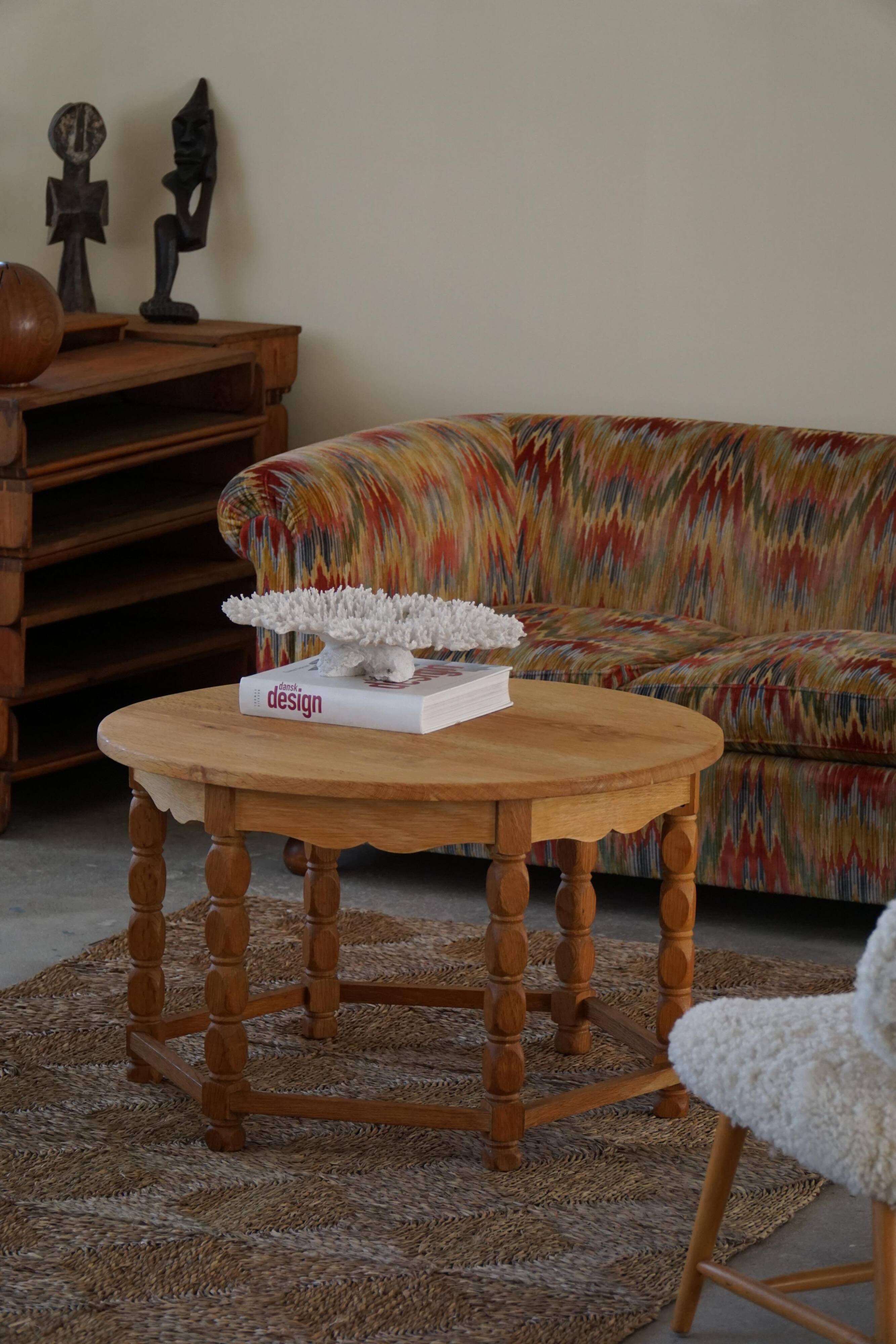 Danish modern and brutalist round coffee table in solid oak, 1960s.