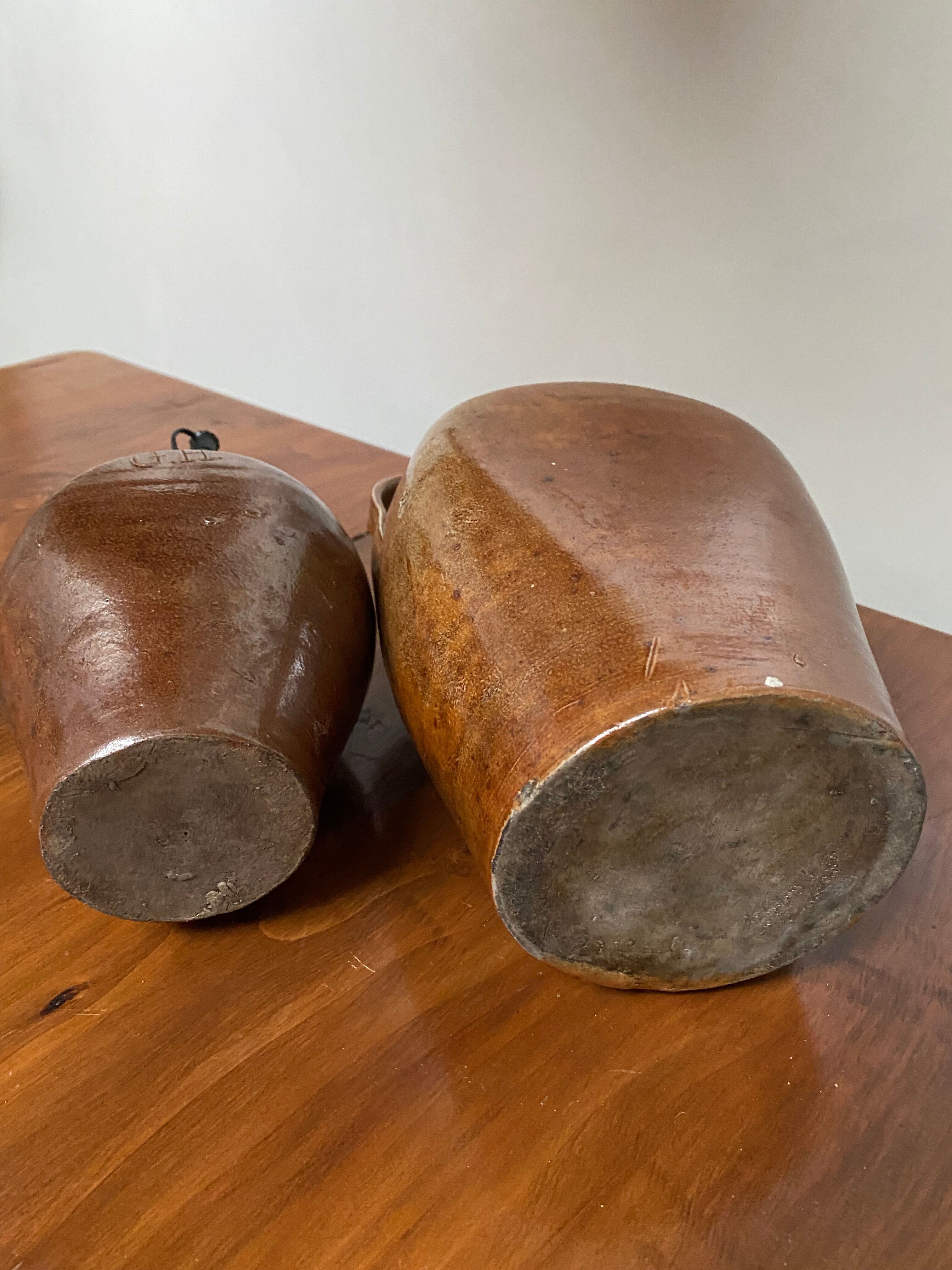 Pair of bottles in sandstone