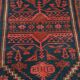 Tapis ancien noué main en laine