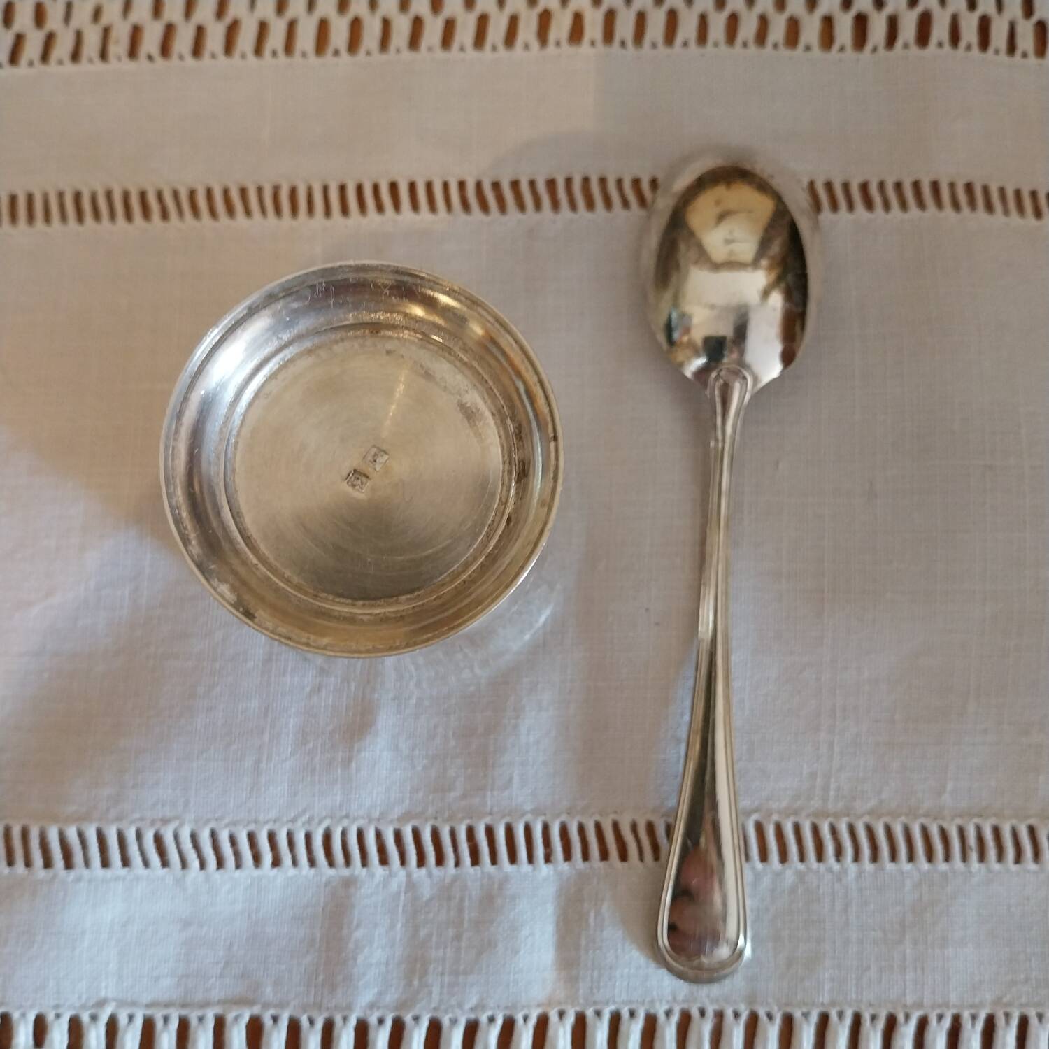 Egg cup and spoon in silver metal