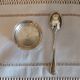 Egg cup and spoon in silver metal