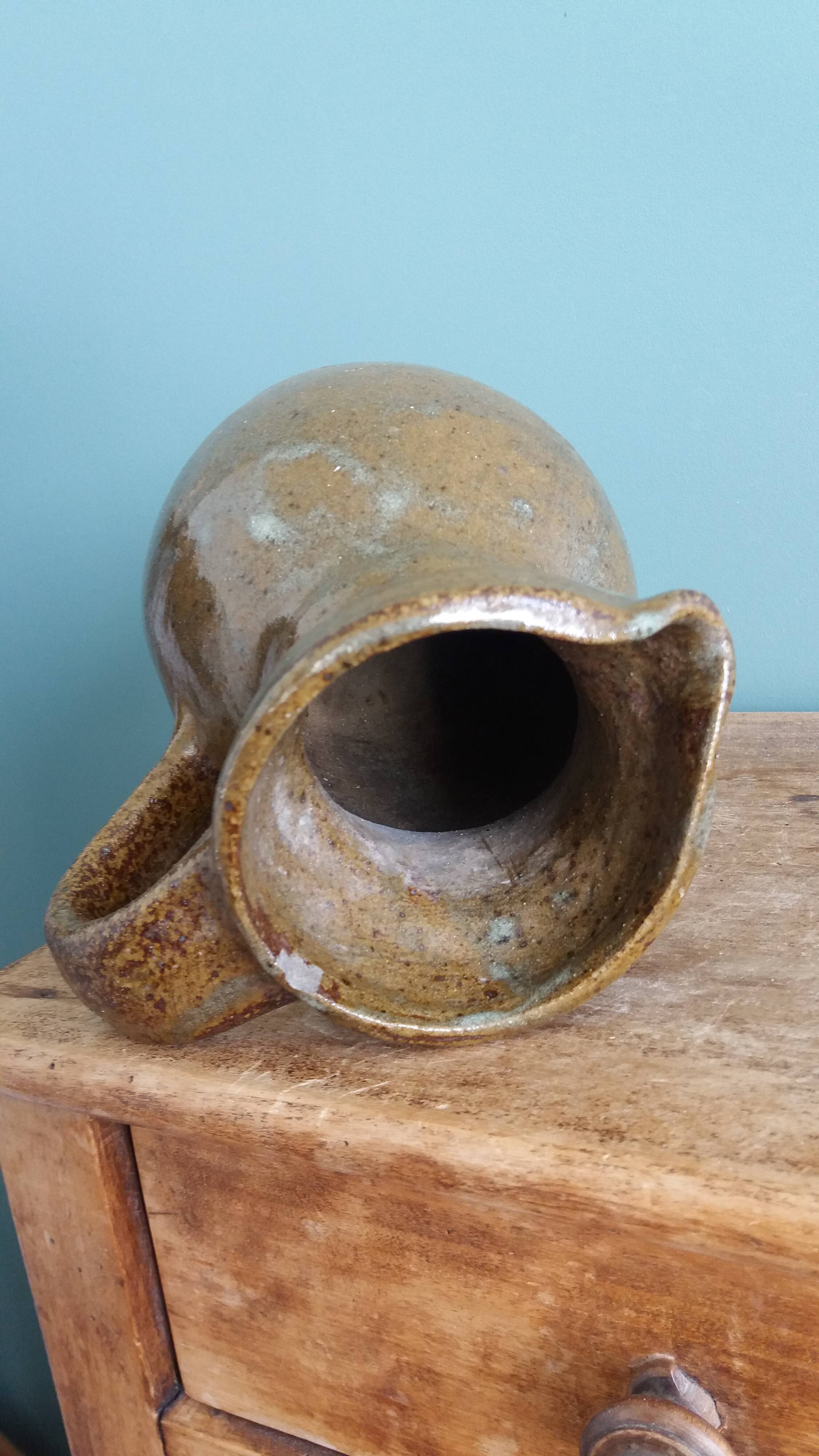 Rustic stoneware jug, chic countryside.