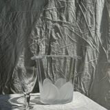 Glass ice or champagne bucket with stylized petal patterns