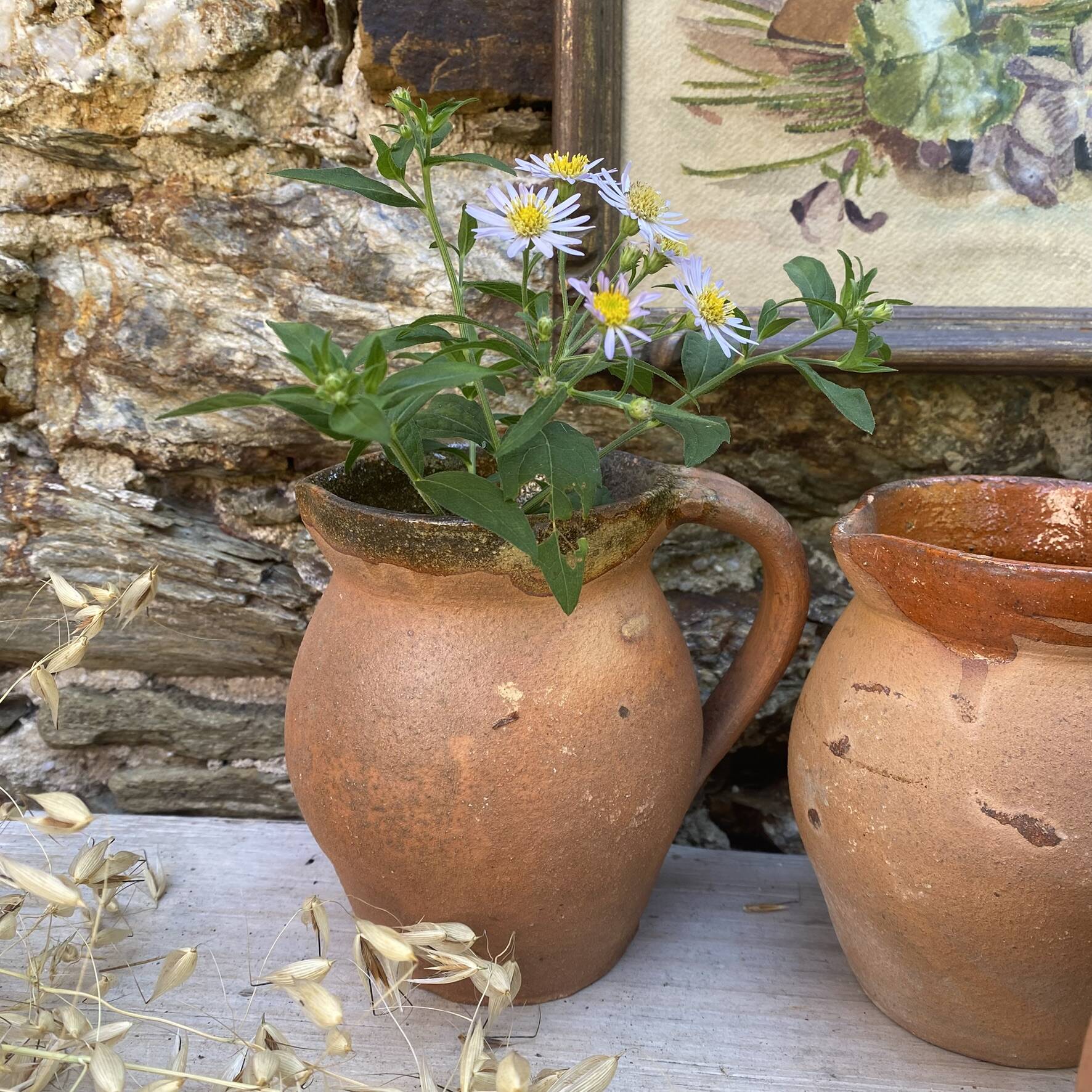 set of terracotta jugs country style