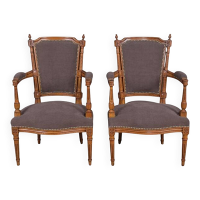 Paire de fauteuils en hêtre teinté, style Louis XVI – 1950