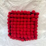 Vintage cushion red pompoms