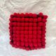 Vintage cushion red pompoms