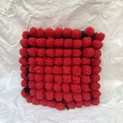 Vintage cushion red pompoms
