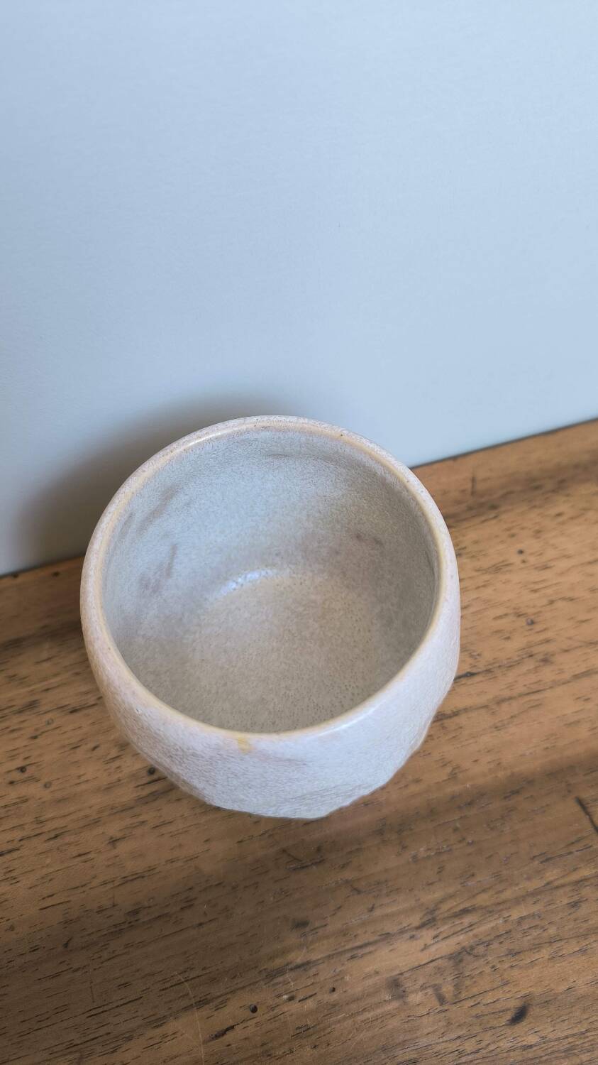Faceted ceramic cup, handcrafted stoneware, turned, pale yellow enamel