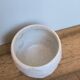 Faceted ceramic cup, handcrafted stoneware, turned, pale yellow enamel