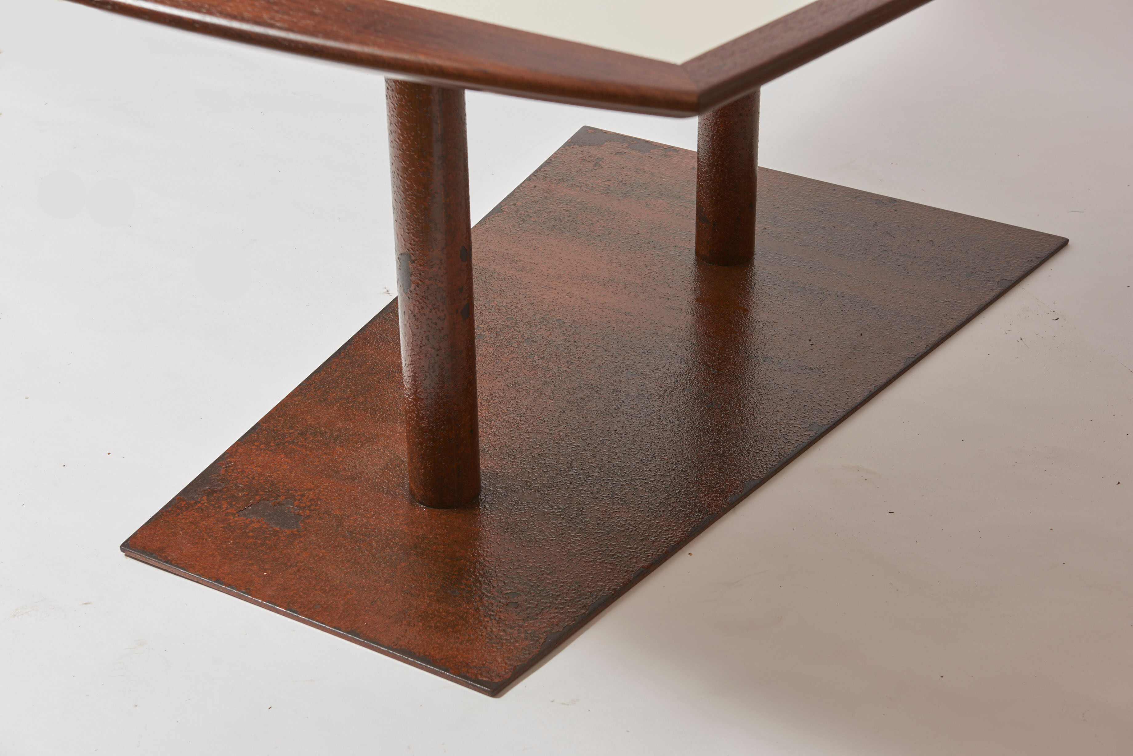 Brutalist conference table made of wood and steel