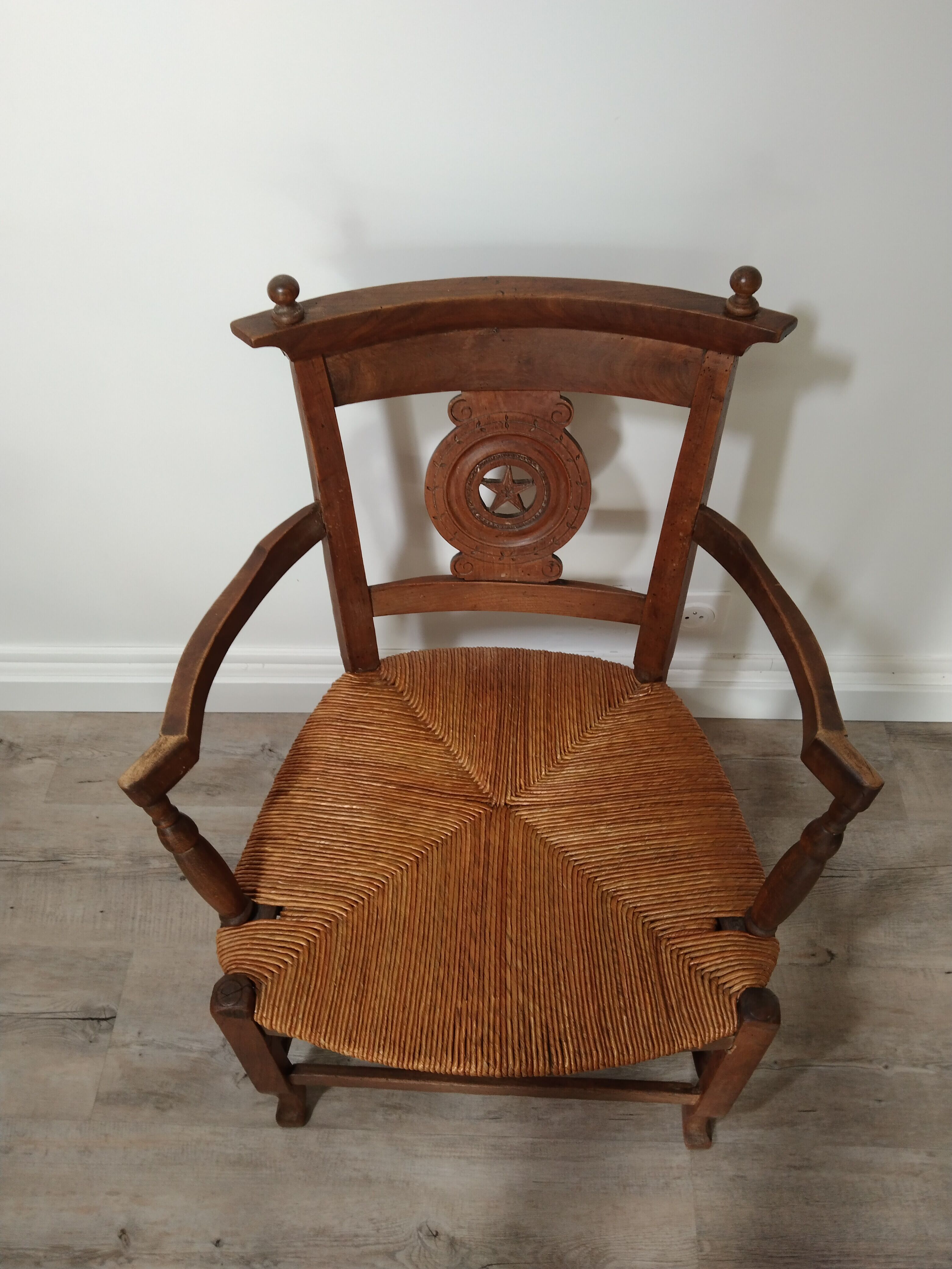 Straw armchair folk art.