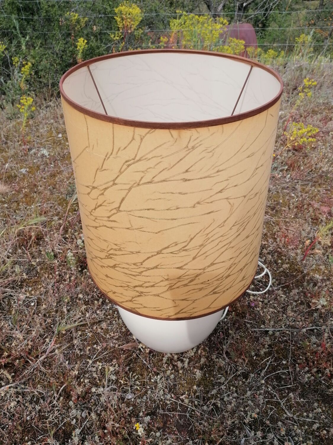 Vintage ceramic table lamp and golden lampshade.