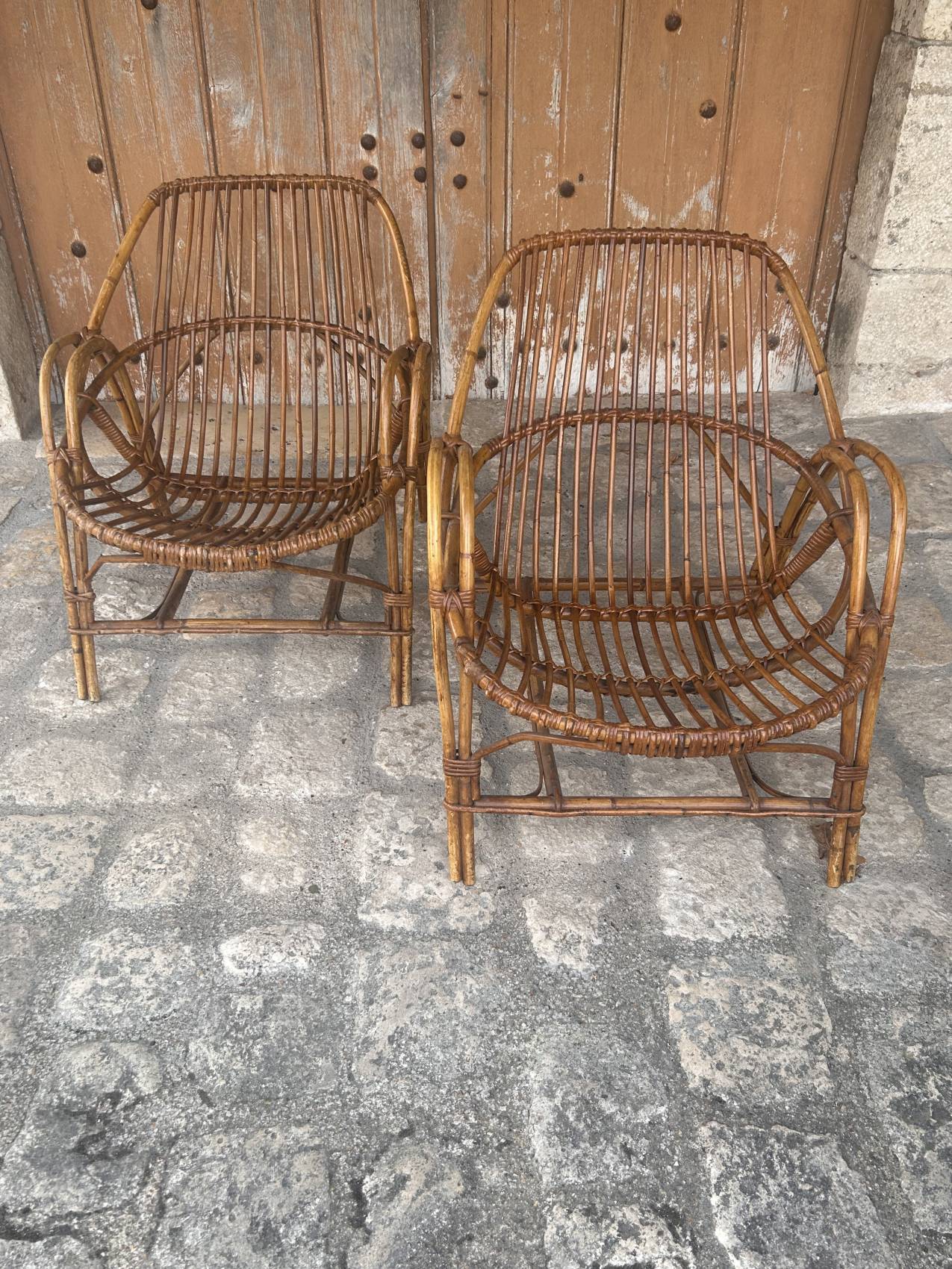 Pair of vintage rattan armchairs from the 1960s – a perfect timeless piece for indoors and outdoors.