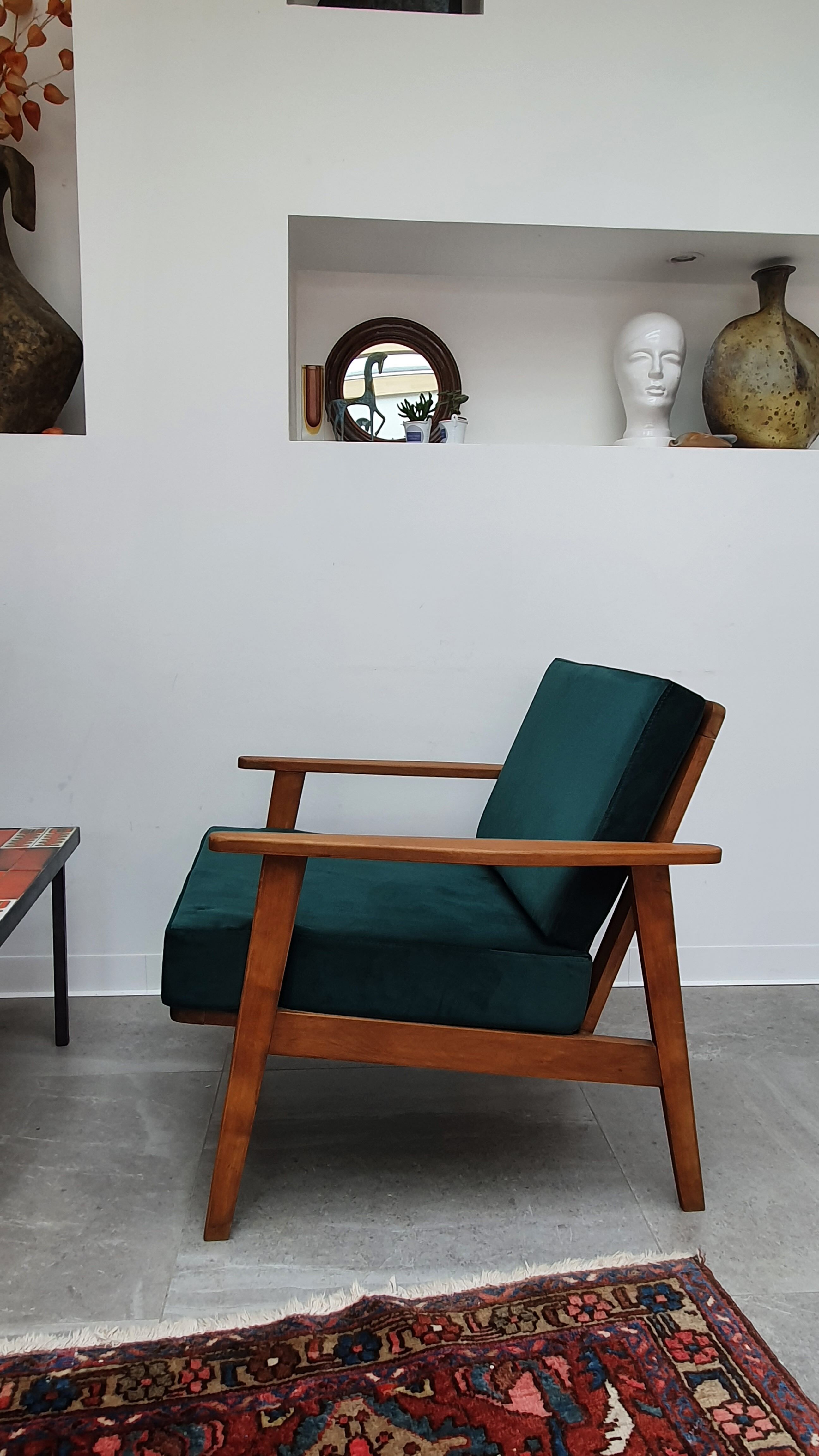 Scandinavian style armchair in forest green velvet