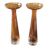 Two vintage Scandinavian double-layered amber blown glass candlesticks