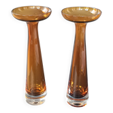 Two vintage Scandinavian double-layered amber blown glass candlesticks
