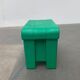 Postmodern plastic stool with a wood effect.