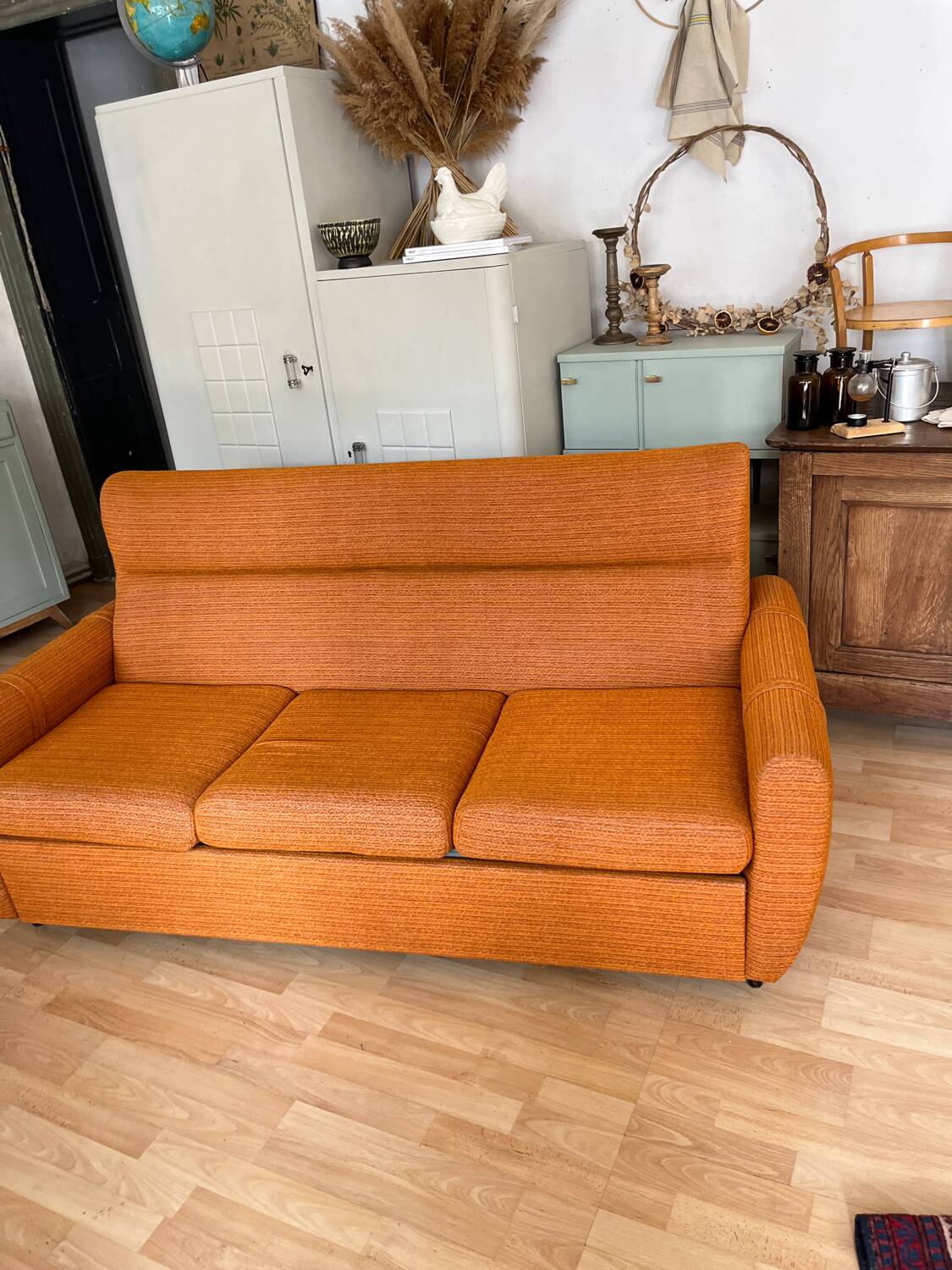 Vintage orange convertible sofa