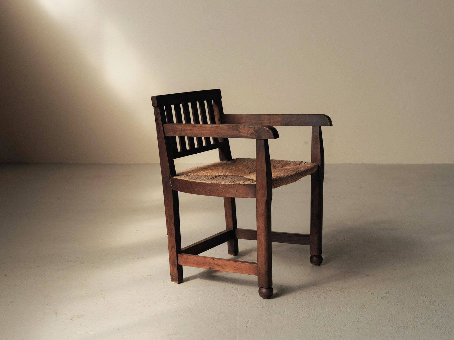 Handcrafted oak and straw armchair, France, circa 1950.