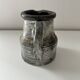 Patinated pitcher signed
