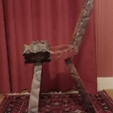 Brutalist chair with tripod legs