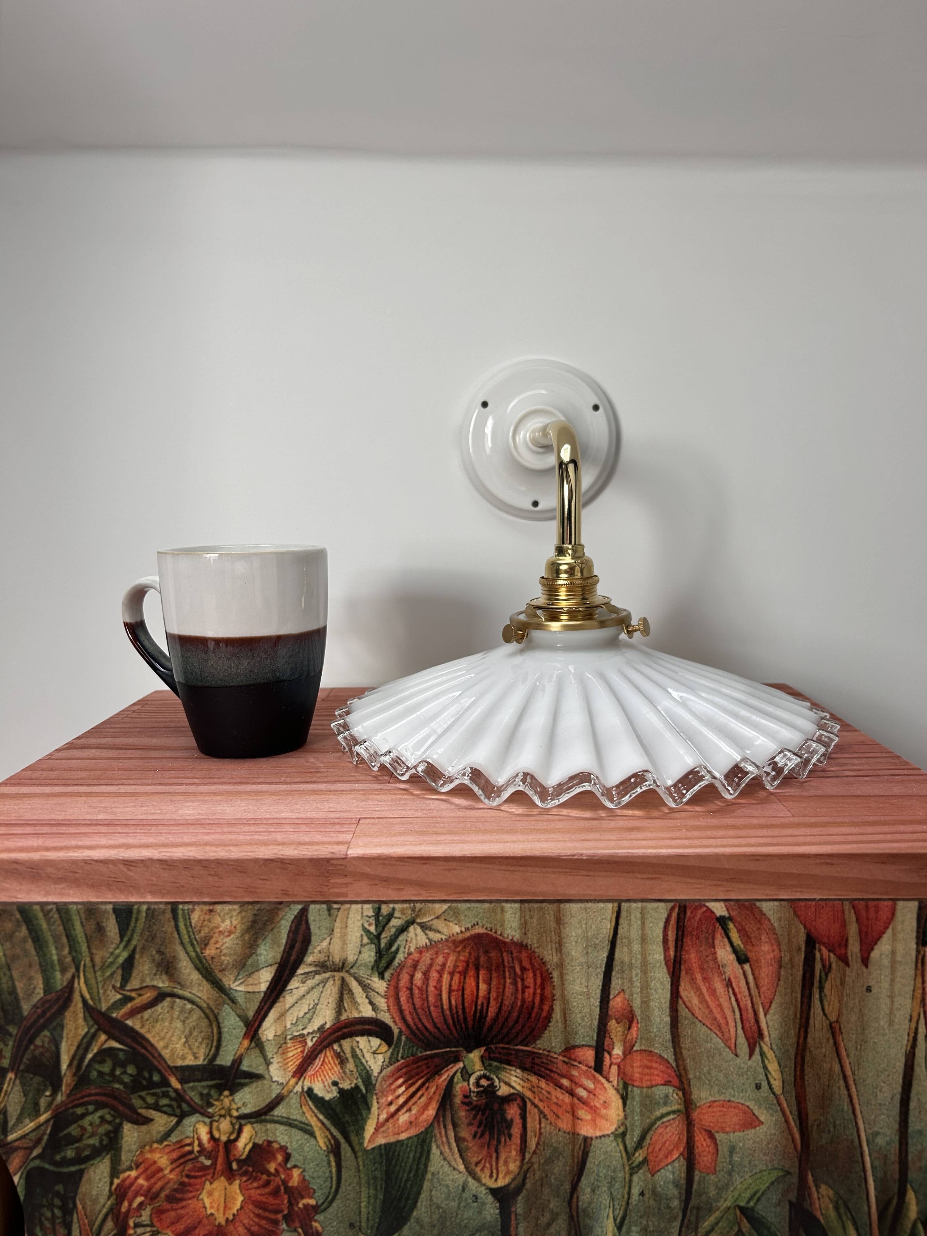 Two wall sconces in serrated white opaline