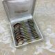 Box of 12 old spoons