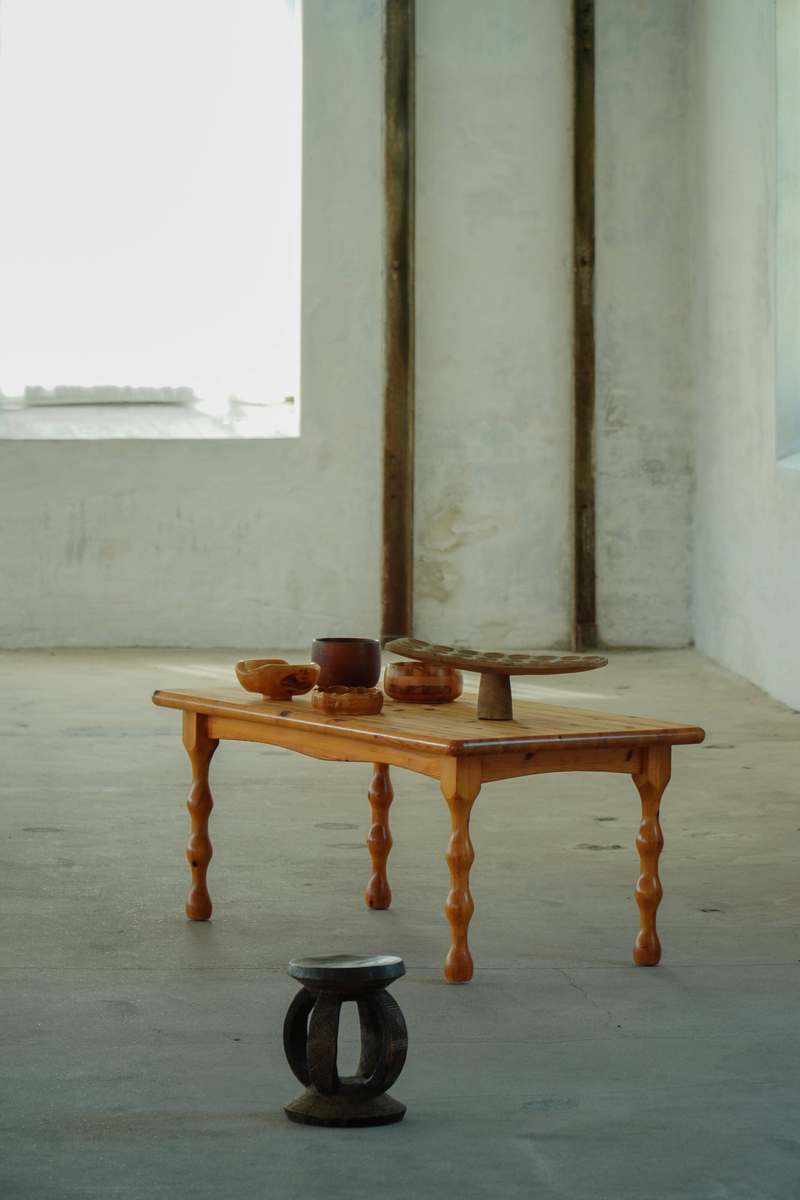 Scandinavian coffee table in brutalist style made of pine, with turned legs, Danish modern style, 1970s.