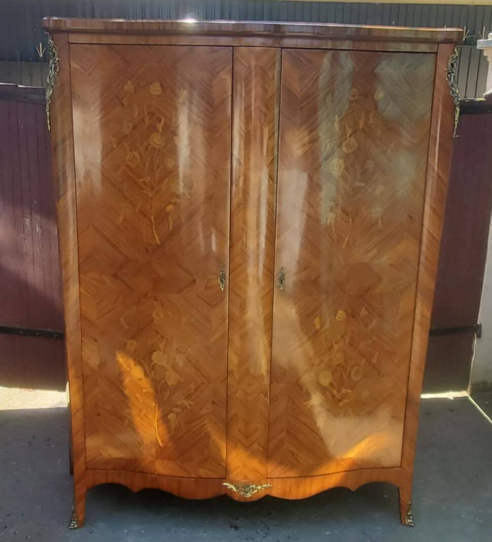 Two-door cabinet with marquetry floral design from the early 20th century.