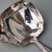 Louche à sauce en métal argenté