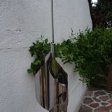 Hanging space age stainless steel