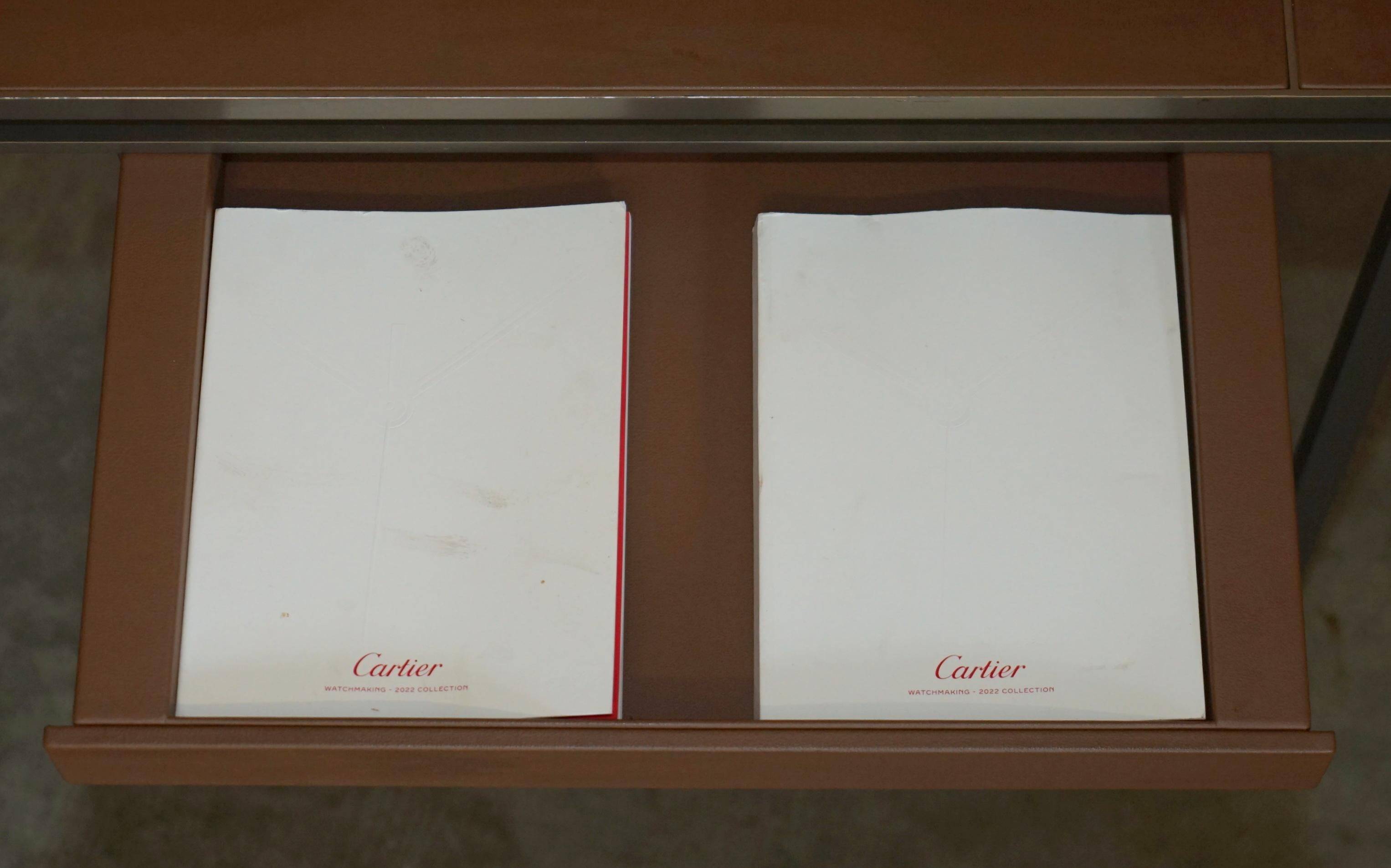 Modern mid-century writing desk signed Cartier in bronze and leather.