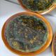 Set of 4 flamed enamel plates in green and amber from the 60s-70s.